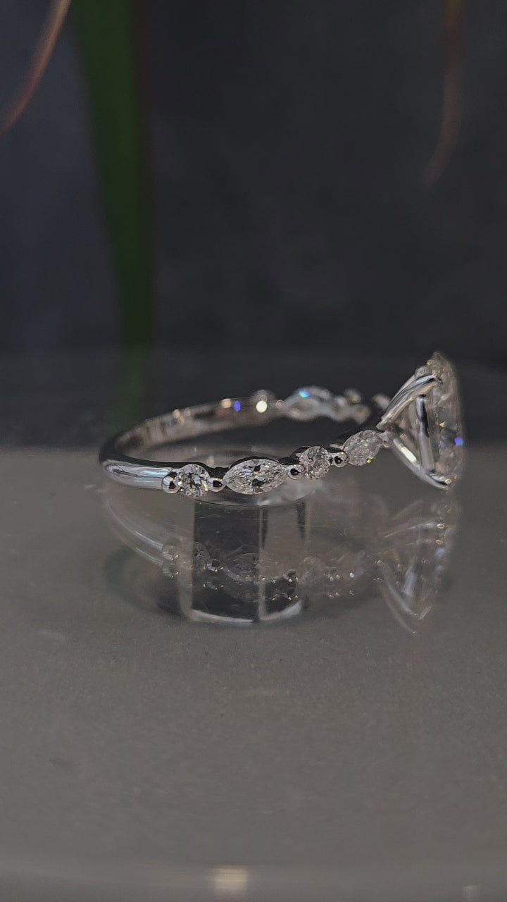 Oval-Cut Ring with Marquise & Round Diamonds